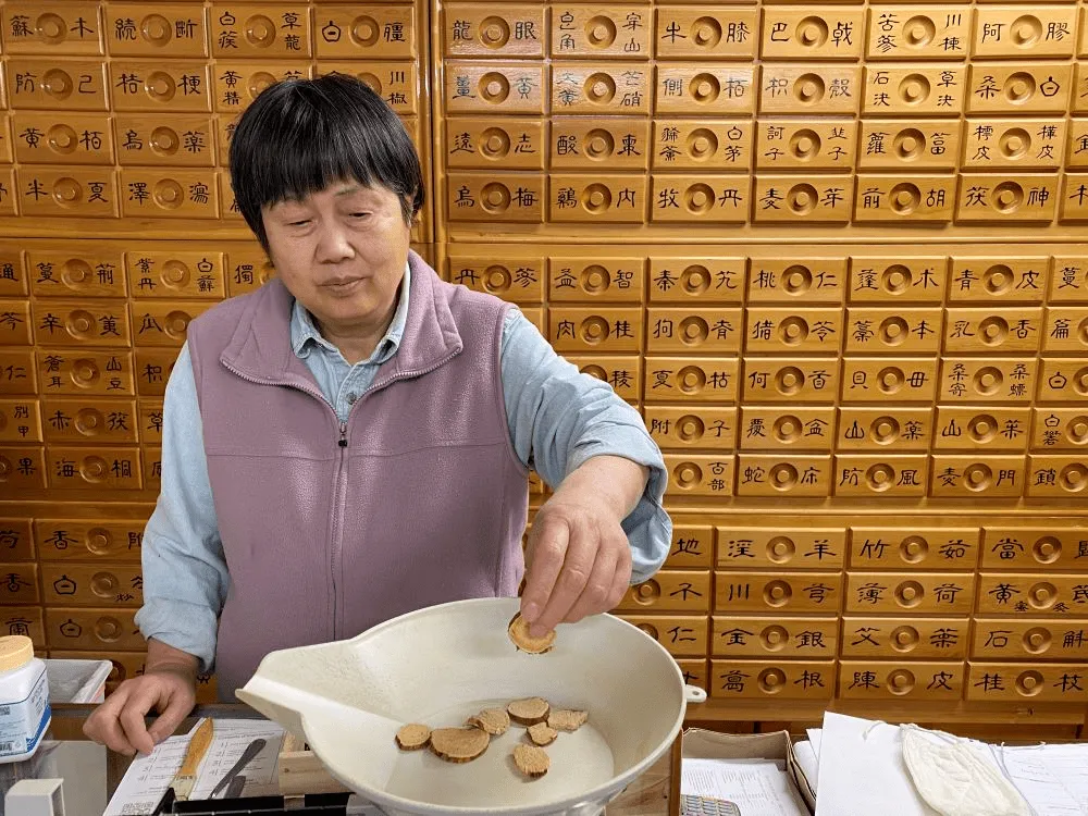 Our herbalist, Wei Li, LAc, Dipl Ac, MD(China)